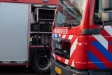 Bus Walibi Express in brand op parkeerplaats attractiepark